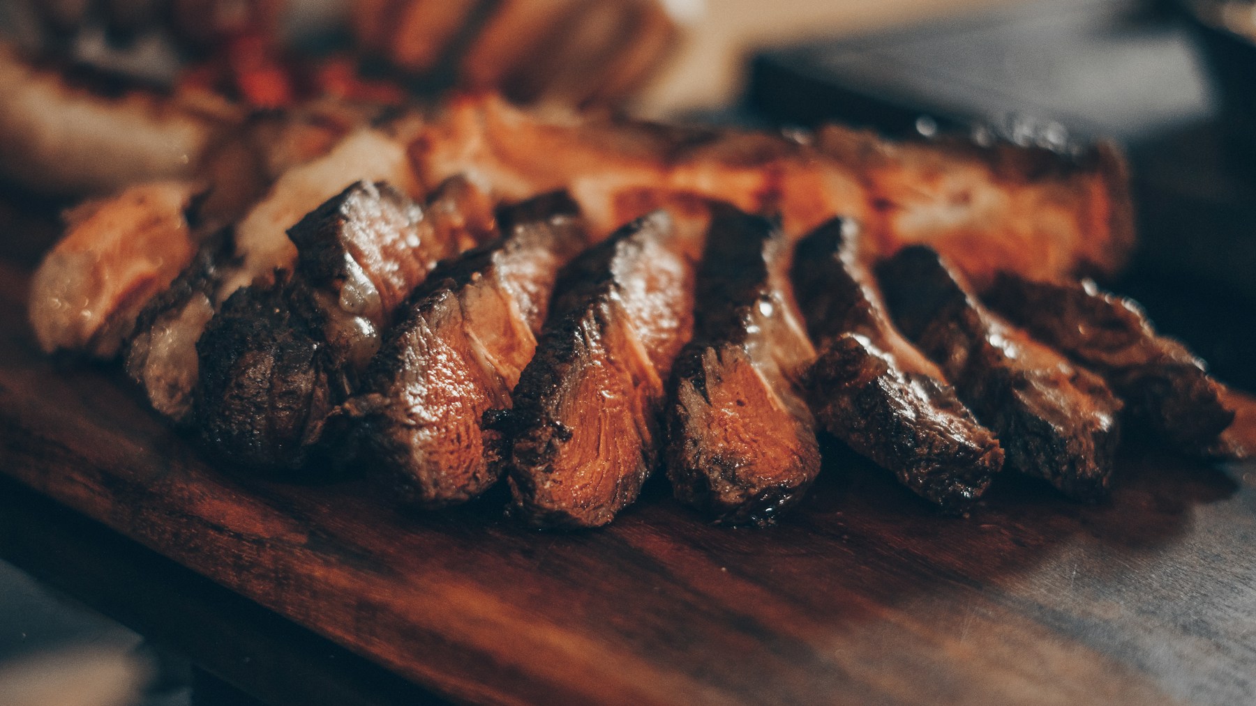 Sliced beef on a wooden board